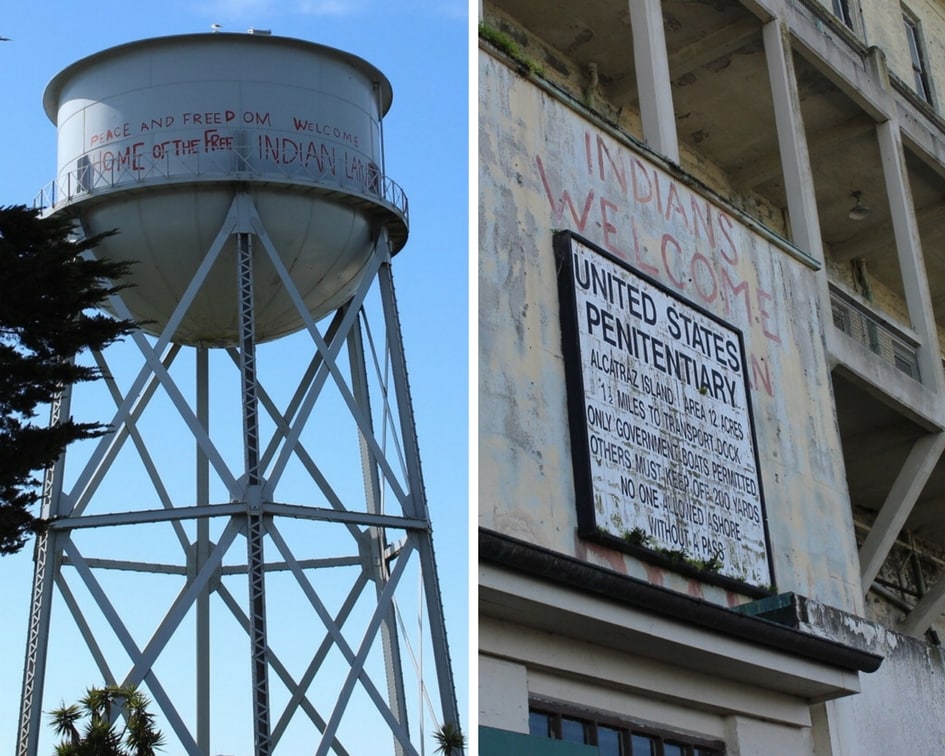 watertower and building on Alcatraz Island. building has sign that says "united states penitentiary"